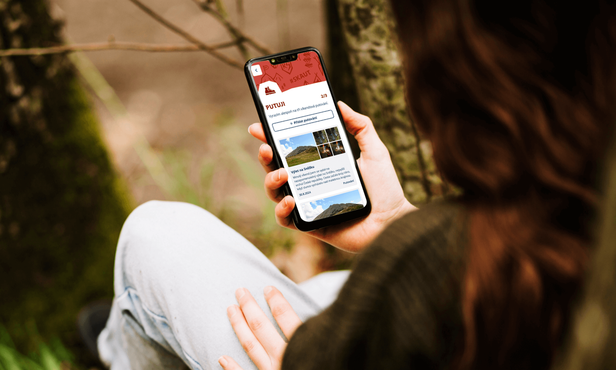Putuji displayed on mobile phone held in hand
