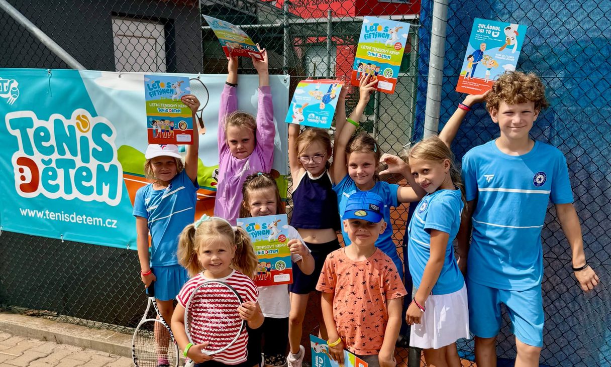 Kids in shirts with project logo