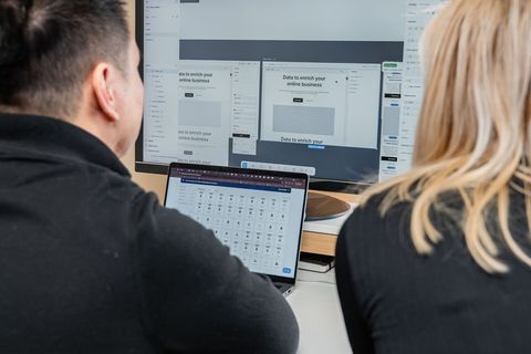 UXF consultants reviewing a new website design