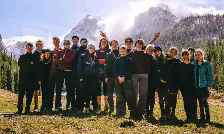Group of people in mountains landscape