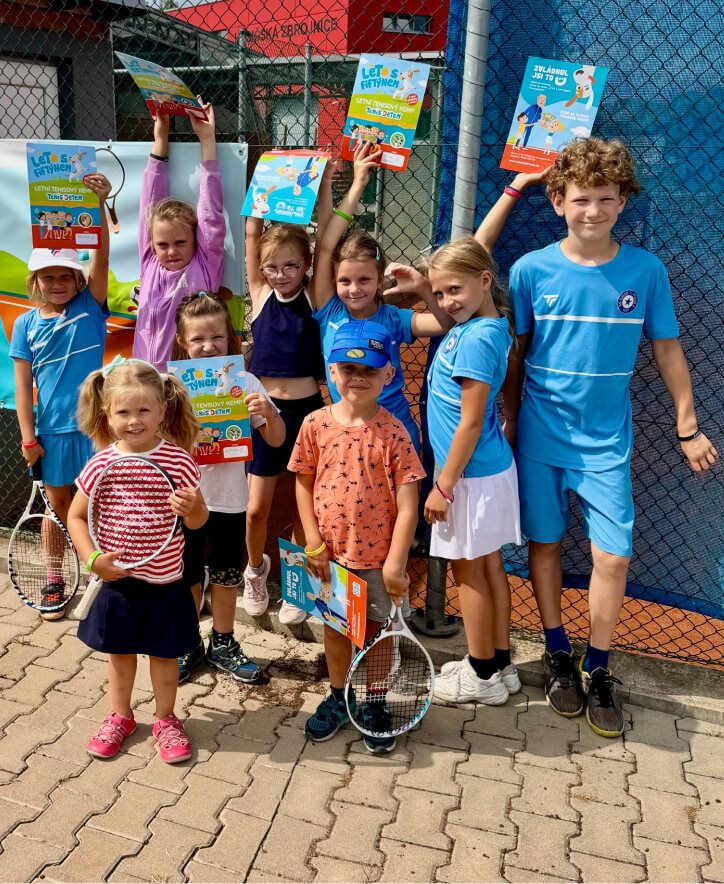 Kids in shirts with project logo